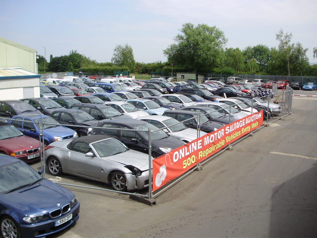 Auction cars for inspection on a lot at ASM Auto Recycling in Thame, Oxford.